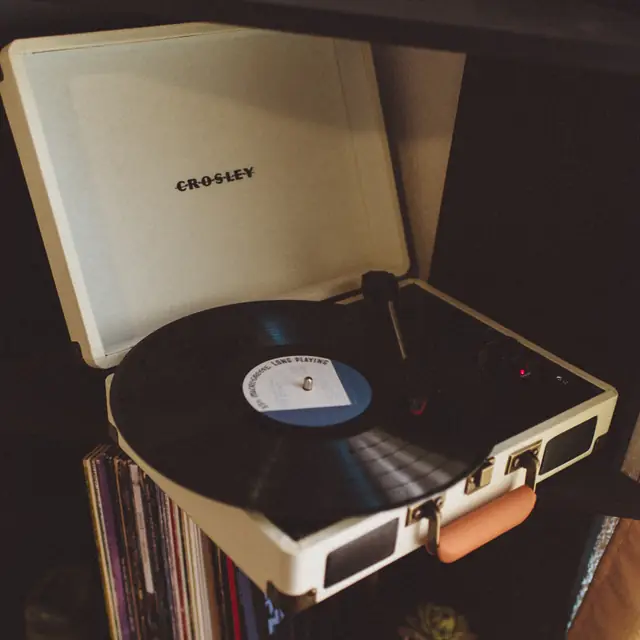 Portable turntable playing a record